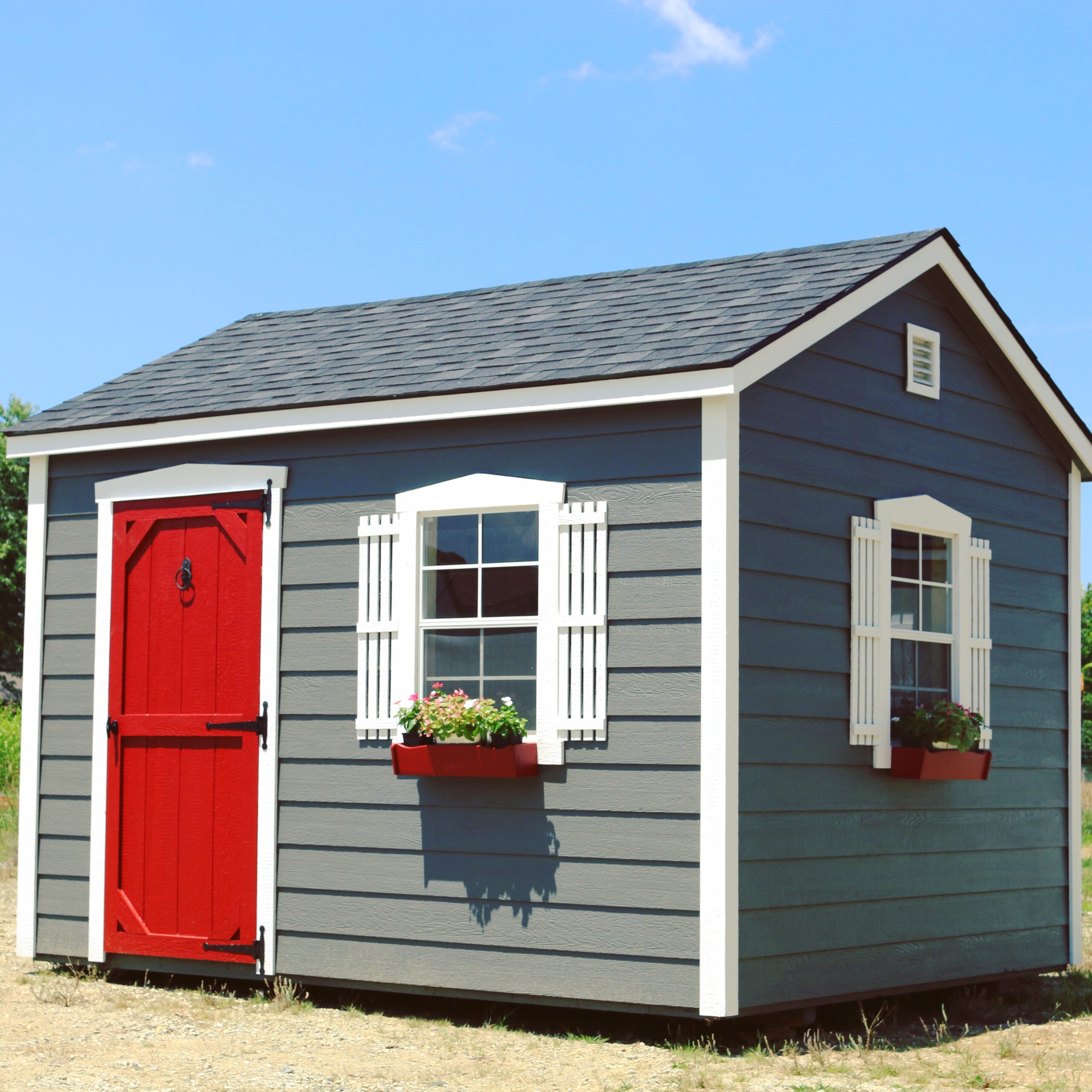 Sheds By Design lap series shed red barn door and red flower boxes 
