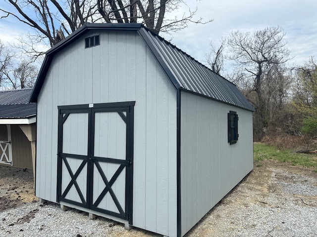 S26017 12x20x7 Barn in Light Gray with Black trim, 6′ Double door, 2x 18×27 Windows and a 4′ Loft, 40 Year Black Metal Roof