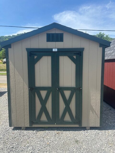 S25013 8x12x7 Classic Cottage in Buckskin with Dark Green trim, 3D Charcoal Shingles, 4′ Double Door, 18×27 Slide window