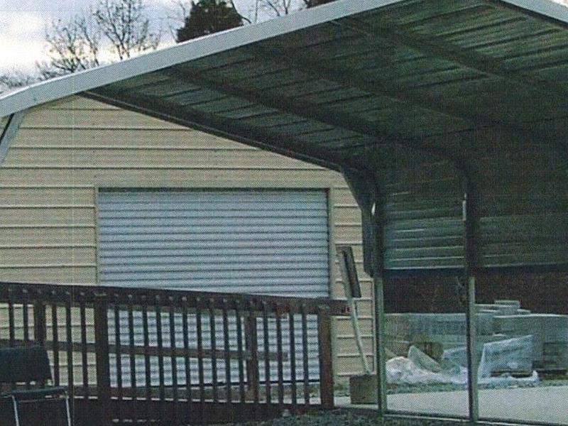 Regular carport with extra panels on side