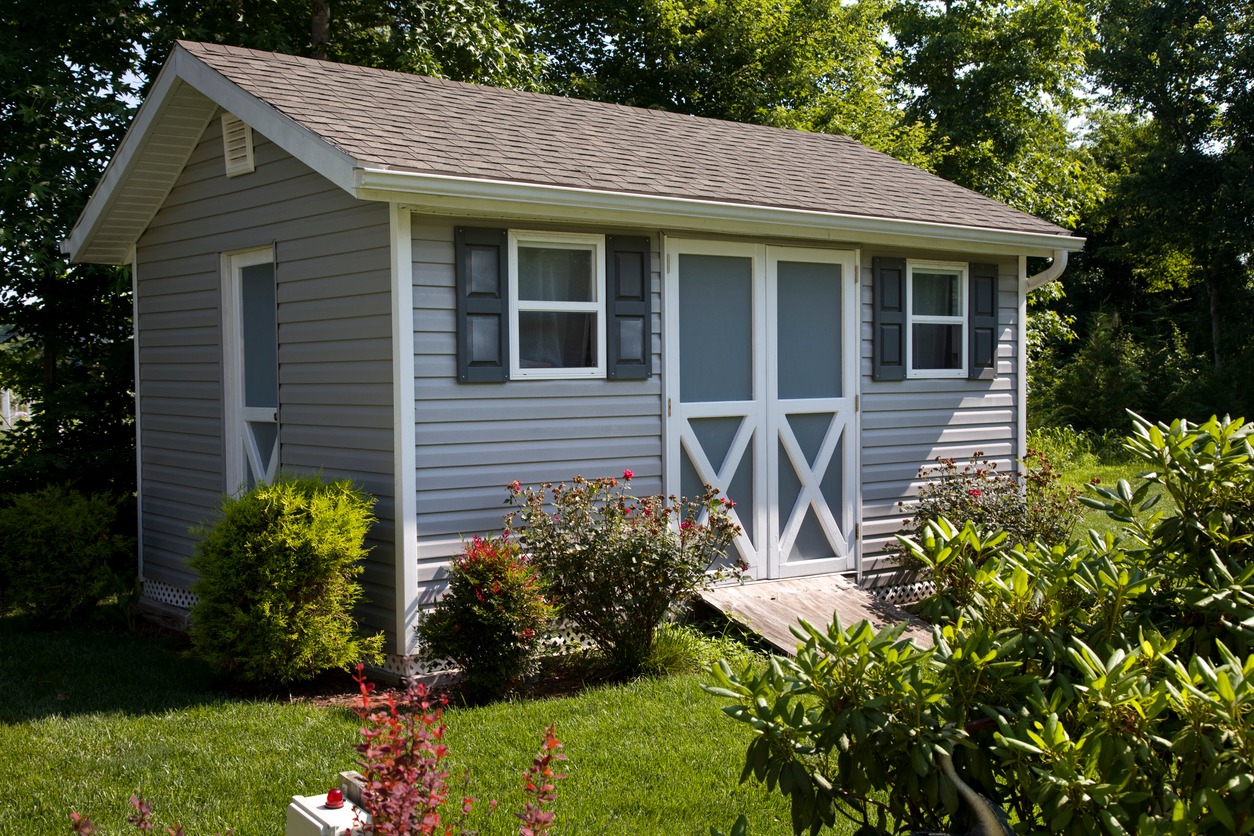 Utility shed in suburban home back yard.