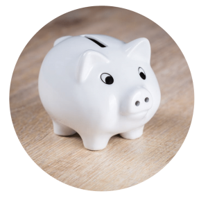 Piggy bank in a wooden table top.