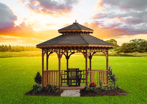 field of green grass at sunset