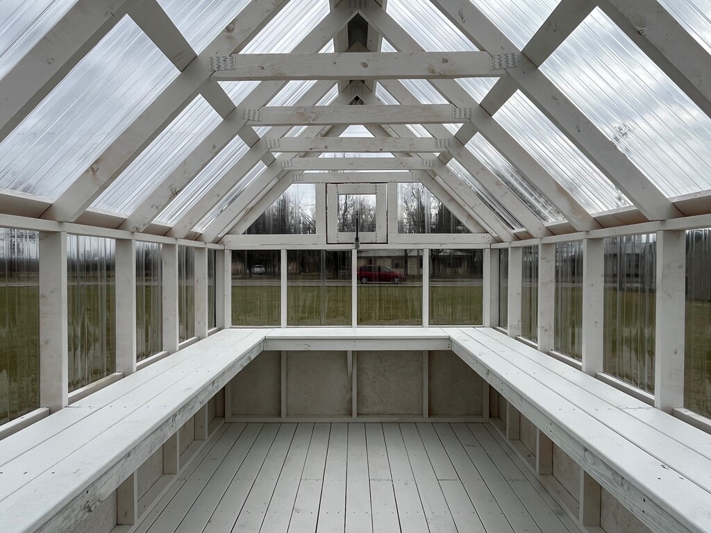 Greenhouse interior with Deck-board potting shelf around the perimeter (sides and back wall)