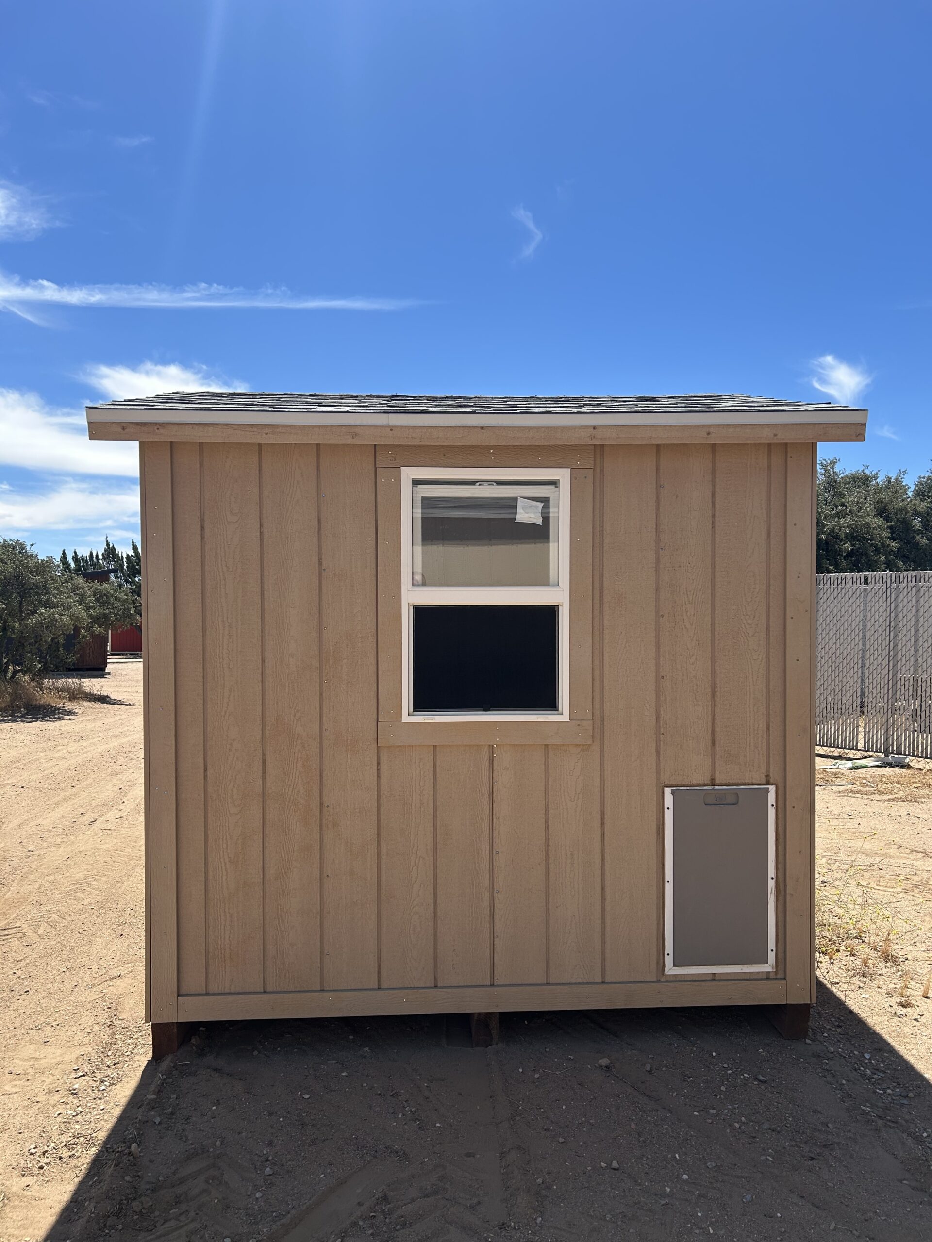 SOLD USED 8x8 Peak 7 With Dog Door and Window STK #2434A