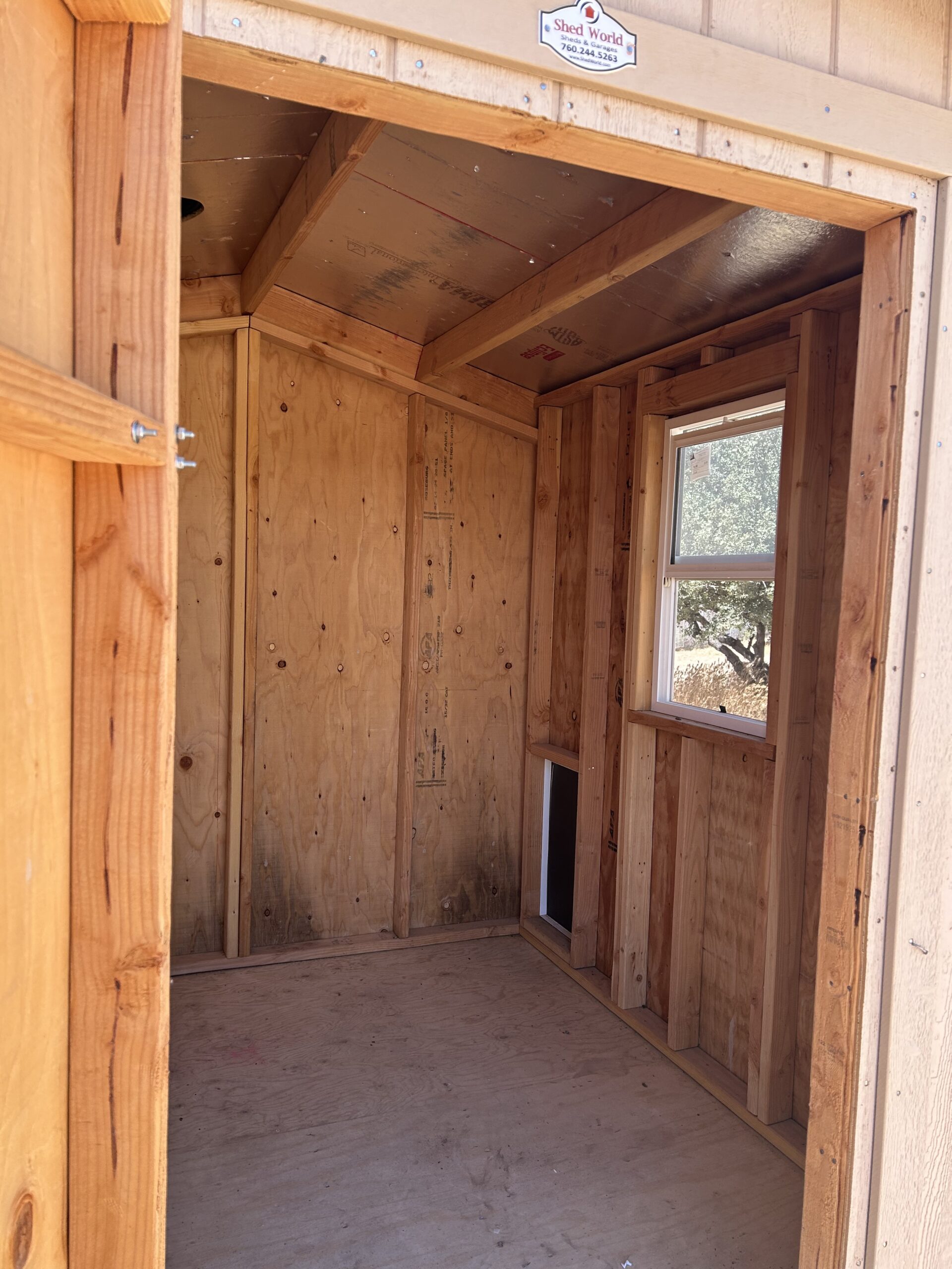 SOLD USED 8x8 Peak 7 With Dog Door and Window STK #2434A